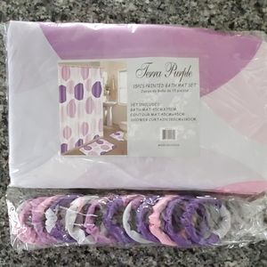 Purple and pink shower curtain with hangers